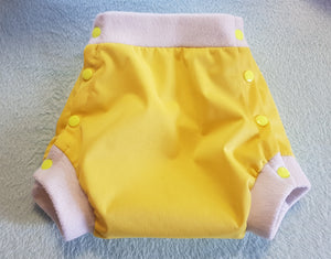 Shorty uni pul/micropolaire à pressions (couleurs au choix)